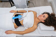 © PintoArt - Woman receiving non invasive body sculpting fat reduction treatment