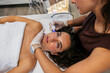 © PintoArt - Woman receiving hydrofacial treatment for skin rejuvenation