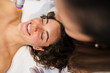 © PintoArt - Woman smiling receiving professional facial beauty treatment