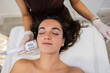 © PintoArt - Woman receiving facial skincare treatment in beauty salon