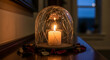 © NoorStockHouse - candle glowing inside cracked glass dome — remembrance and reflection