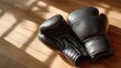 © filmanana - Boxing Gloves at Rest in Warm Sunlight — calm pause after training, minimalist still life on wooden floor, soft natural light for fitness motivation, discipline, gym branding
