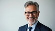 © Maryna - Mature smiling businessman wears glasses, suit, and tie. He has grey hair and looks at the camera with confidence. This portrait signifies success and experience in the corporate world.