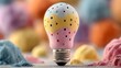 © Maryna - Light bulb is covered in ice cream and sprinkles. The light bulb is surrounded by colorful objects, including a pile of ice cream and a pile of sprinkles. The scene is playful and whimsical