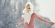 © rohappy - Happy smiling young woman in winter day, joyful girl in white hat, sweater enjoys warm weather