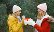 © rohappy - Winter happy women friends holding gift box, celebration, joyful girlfriends together in Christmas