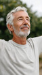 © Sergey - Senior man enjoying mobility exercise outdoors promoting healthy aging