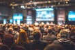 © hao - Back view of audience in the conference hall or seminar meeting with large media screen showing video presentation, business and education concept. High quality