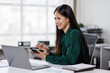 © David - Asian business woman Auditor or internal revenue service staff checking annual financial statements company Audit  Accounting tax