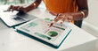 © FrameOn/peopleimages.com - Typing, laptop and hands of woman with tablet for graphs, planning and online report. Tech screen, office and employee with research for documents, proposal or administration with project management