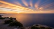 © supra - Stunning sunset paints the ocean gold from a cliffside vista, perfect for travel inspiration and serene landscapes, capturing the magic of a coastal getaway