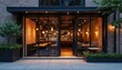 © Pete - Modern restaurant with large glass windows, brick wall. Inside shows warm lit bar, dining area. Outdoor patio seating with plants. Urban city building facade at dusk for eating, drink business.
