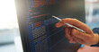 © SiphosethuFan/peopleimages.com - Analyze, code or hand in office with computer screen, software error or data check in debug process. Programming, man or system analyst in agency with pen, performance or log review for best practice