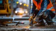 © santima - Construction worker welding in urban environment.