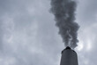© yaqui_villegas - Closeup of a smokestack releasing steam and vapor into the sky, with cloud layers and metal details visible in an industry environment under heavy overcast conditions and subdued atmospheric lighting