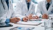 © kaiyalad - Collaborative Healthcare Meeting Medical Office Professional Discussion Modern Environment Close-up View Medical Insights