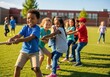 © Ozz - Children playing tug-of-war on a sunny day at an outdoor school event