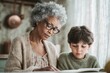 © misunderst00d - Elderly Black woman helping grandson with homework, focused on workbook in vintage kitchen