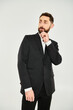 © LIGHTFIELD STUDIOS - Bearded man in elegant suit shows charm and style for Valentines Day celebration