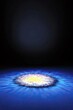 © Tisna - A bright, abstract, circular light source with yellow and white hues emanates from the center, casting ripples across a deep blue surface.