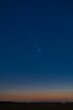 © badescu - Spectacular Celestial Phenomenon: The Rare Comet ATLAS 2024 Visible Against a Deep Red Post-Sunset Sky During Astronomical Twilight