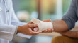 © Denis Yevtekhov - Asian doctor checking splint leg support defocused senior patient, faceless orthopedic treatment, physiotherapy visualization detail, blurred clinic background, trauma care concept