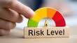 © ryker - Risk level gauge with colorful semicircular scale from low to high and finger adjusting indicator showing performance concern and evaluation emotion