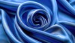 © nurohaman - A close-up shot showcases the luxurious texture and sheen of royal blue satin fabric, artfully draped into a swirling pattern.