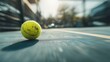 © fotofabrika - Tennis ball rolls on court during sunny afternoon, showcasing motion and excitement of the game
