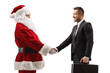 © Ljupco Smokovski - Santa claus shaking hands with a businessman