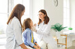 © Studio Romantic - Pediatrician woman examination of throat, female medical practitioner consulting child boy and mother parent for preventing, diagnosing, general practitioner treating teen diseases in clinic, hospital
