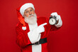 © InsideCreativeHouse - Look attention! Wee can miss festive event party! Worried terrified stressed Santa in costume gloves headwear stylish spectacles show finger forefinger on deadline limit timer isolated red background