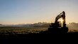© Artur - Excavator silhouette at sunset construction site