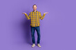 © deagreez - Young handsome man in yellow plaid shirt stands with open arms against purple background for lifestyle fashion and advertising