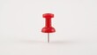 © Lasvu - Red push pin with a sharp metal point. Office supplies and stationery item. Highlighted for note-taking or attaching papers. The push pin is a common tool in office and craft settings.