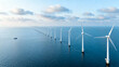 © Video80X - Aerial shot of offshore wind turbines in the ocean with a boat nearby, ideal for renewable energy projects or environmental articles.