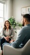 © MMerellinn - Mature woman therapist engaged in meaningful discussion with male client during psychotherapy session for emotional healing and mental hygiene wellness.