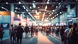 © hao - Blurred of Trade fair expo trade show booth international business convention event showcase center with large scale crowd of people gathering to see product and service display. High quality