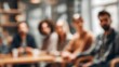 © hao - Blurry Team Meeting Background - Soft-focus image of a team meeting with blurred surroundings. High quality