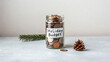 © AucArtStudio - Holiday budget jar with coins for smart holiday shopping and new year christmas savings to plan spending and enjoy celebration without overspend