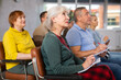 © JackF - Older male and female students listening to lecture in university