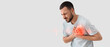 © Pixel-Shot - Young man suffering from chest pain on white background