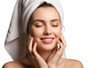 © Das Indira - Young woman enjoying post-shower skincare routine with towel wrapped hair transparent background