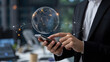 © Muhammad - Sophisticated businessman connecting globally with phone, visualizing digital world, futuristic modern business, seamless communication and international networking