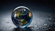 © JuliaDorian - A Stunning Glass Sphere Reflecting Earth s Surface on a Wet Black Surface with Water Droplets