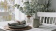 © Anastasiya Ri - Bright dining table decorated with eucalyptus branches ceramic dishes and linen napkins in soft daylight ideal for home decor visuals lifestyle blogs and cozy interior themes