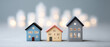 © จรัญ กาษาวัต - Three small model homes in a row, illustrating diverse housing options and the concept of choice within the dynamic real estate market and urban development