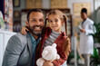 © Drazen - Happy father and daughter in a pharmacy looking at camera.