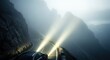© Ahmad - Driving through a misty mountain pass with bright headlights illuminating the fog.