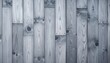 © sanstive - Gray, vertically aligned wood planks with natural knots and grain creating a textured backdrop